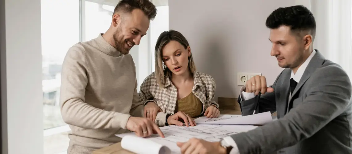 Young Australian couple reviewing a property valuation report before applying for a mortgage