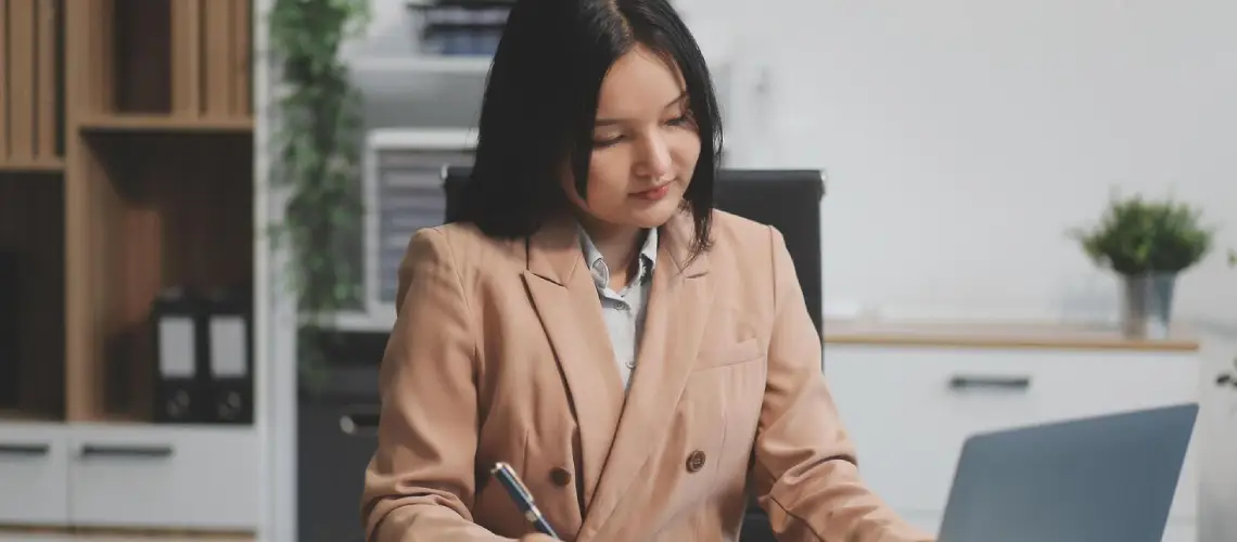 Businesswoman analysing business valuation report in Hobart office